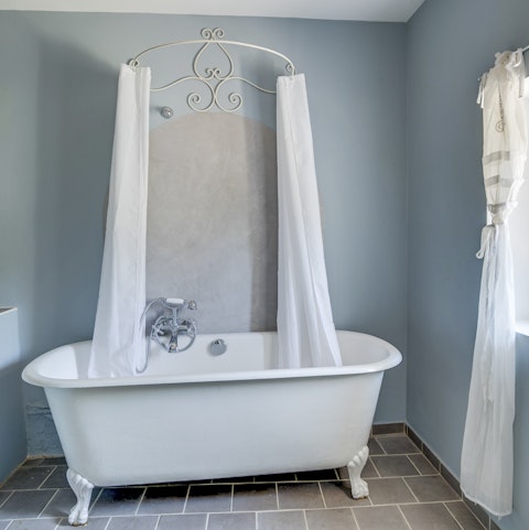 Lie back and relax in the elegant freestanding bathtub