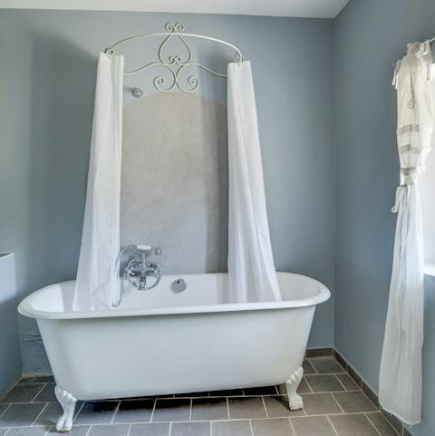 Lie back and relax in the elegant freestanding bathtub