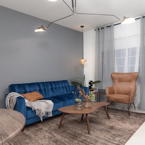 Chill out on the velvet sofa or get comfy in the armchair