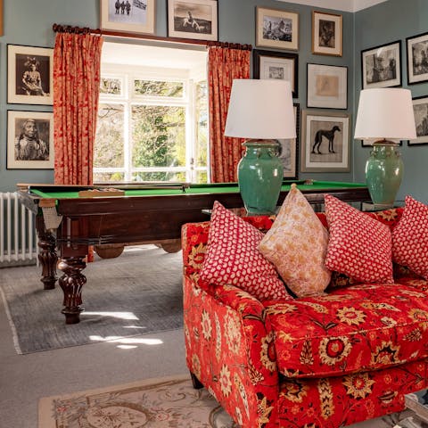 Set up a game of pool in the games room