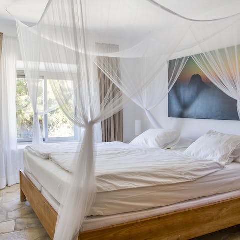 Sleep in luxury on a four-poster bed