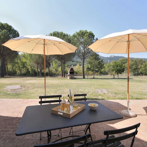 Enjoy views of the Tuscan countryside as you dine alfresco