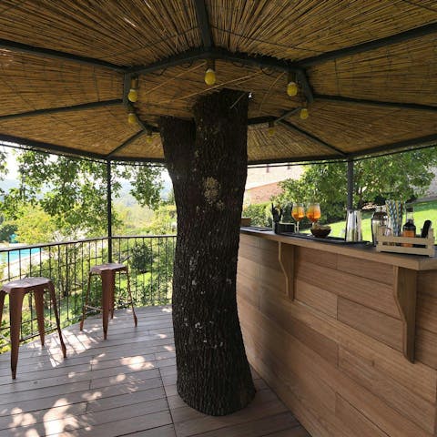 Sip a cocktail overlooking the pool at the shared bar