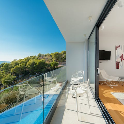 Slide open bedroom doors to private balconies, perfect for morning coffee