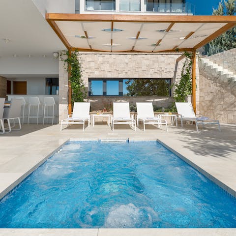 Slip into the sunken Jacuzzi for a rejuvinating soak