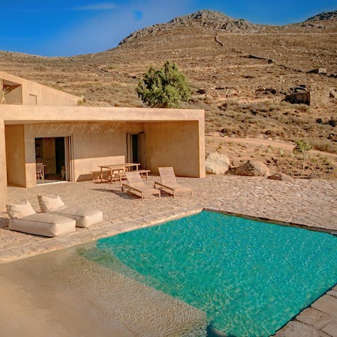 Relax by the tranquil pool with a view