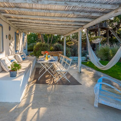 Spend lazy evenings swaying in a hammock as the sun sets