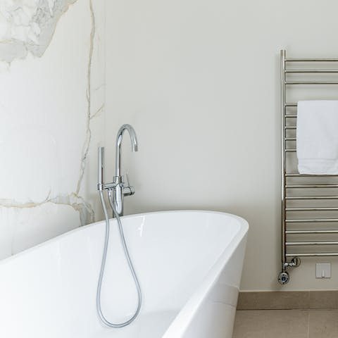 Run yourself a bubble bath in the deep free-standing tub
