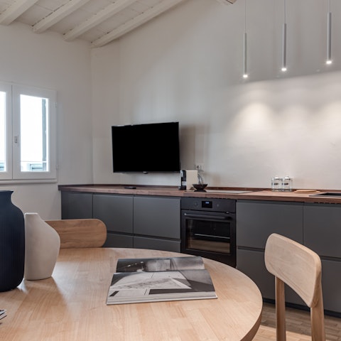 Prepare meals in the sleek open-plan kitchen