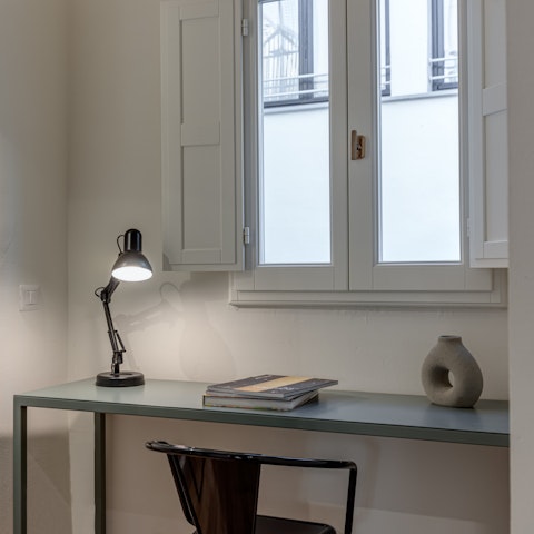 Catch up on some work or reading at the bedroom desk