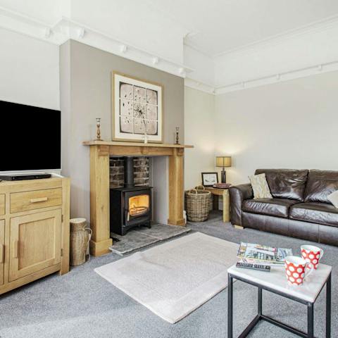 Put your feet up by the cosy log burner on grey afternoons