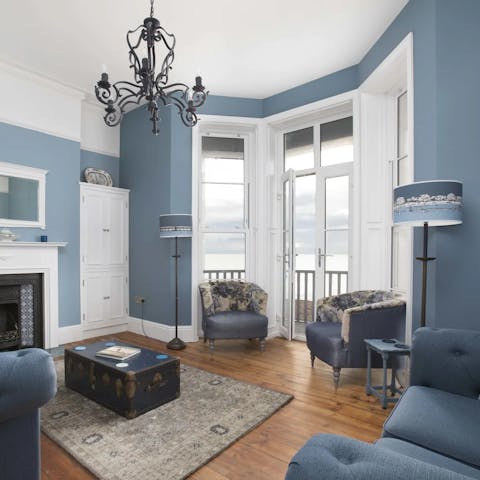 Relax in the cosy lounge, or step onto the balcony for a calming sea breeze