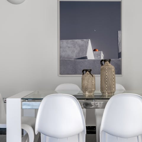 Gather at the elegant dining table for communal feasts