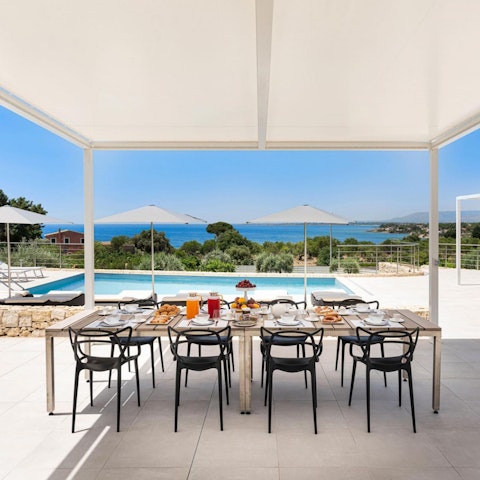 Enjoy glimpses of the Mediterranean Sea as you tuck into lunch