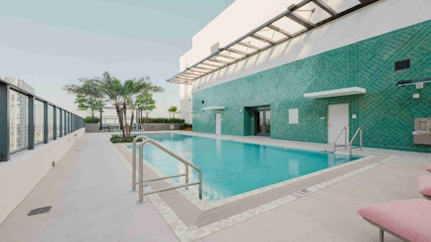 Enjoy a cooling dip in the building's shared rooftop pool