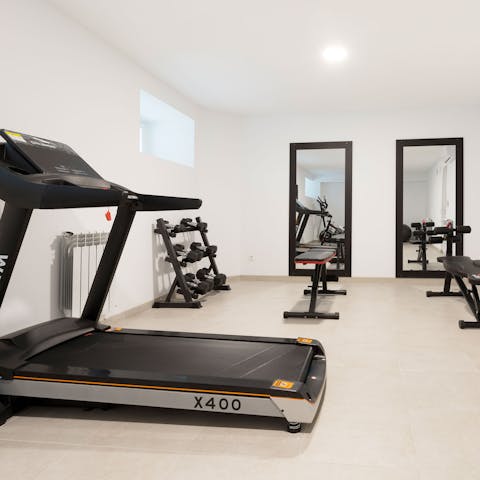 Stay on top of your fitness goals with a workout at the communal gym