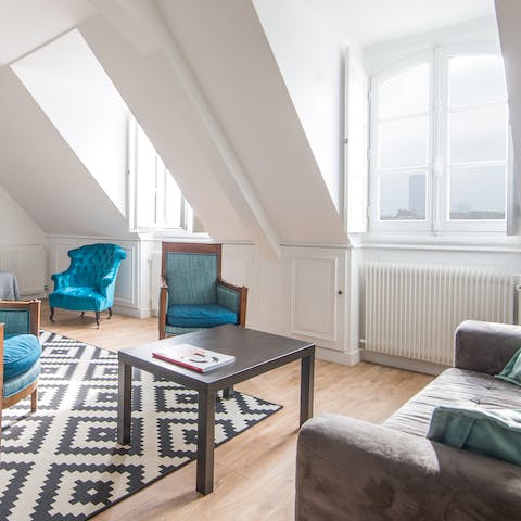 Settle into a plush armchair in a sunny window spot