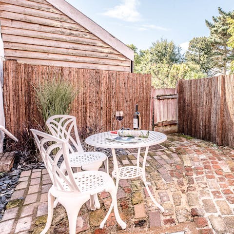 Enjoy a glass of English wine in the cobbled courtyard