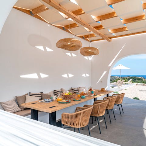 Enjoy fresh pita and feta with olives as you dine al fresco in the shade