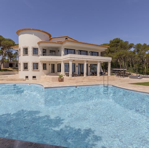 Escape the Mediterranean sun with a lazy dip in the swimming pool