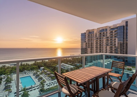 Watch the sun melt into the Atlantic from the balcony