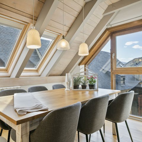 Share a bottle of rioja wine around the dining table and admire the snow-covered rooftops and mountain peaks