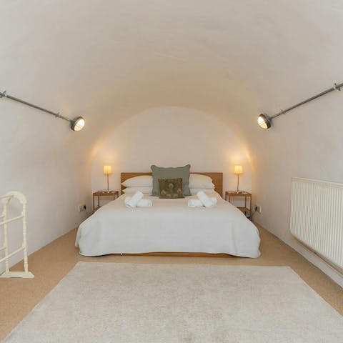 Sleep under cosy vaulted arches in this historic home