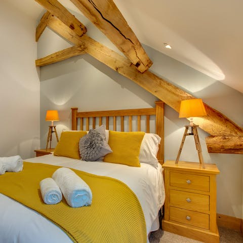 Wake up to original, timber beams in the master bedroom