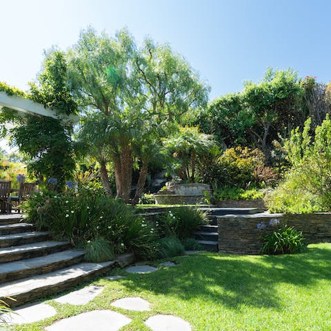 Enjoy playing lawn games in the well manicured backyard