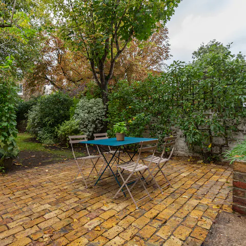 Dine alfresco in the leafy and secluded garden setting