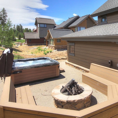 Gather around the fire pit after a soak in the private hot tub