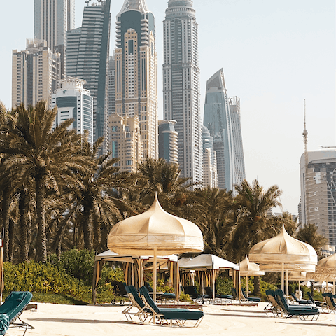 Bask in the sun on Dubai Creek Beach, a short walk away