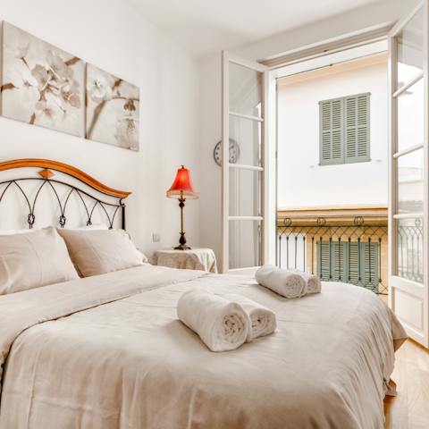 Open up the French doors to the balcony in the morning