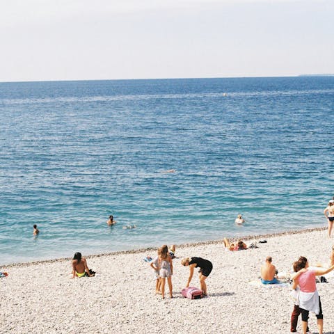 Stroll along the beach at Plage Publique de l’Opera, ten-minute drive away