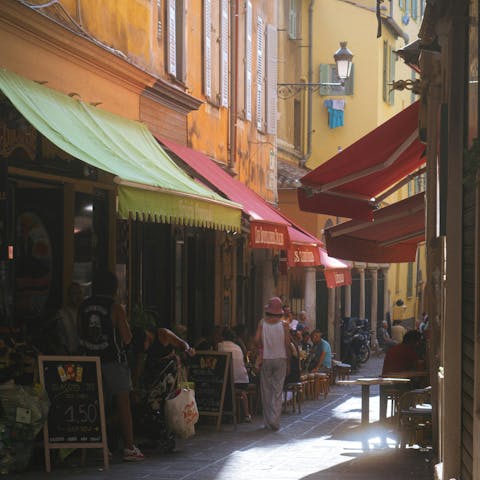 Explore authentic bars and restaurants in Old Nice, ten-minute drive away