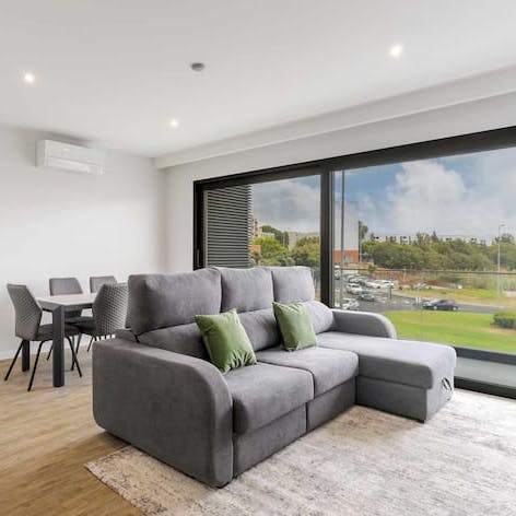 Dine altogether before chilling out on the lounge-worthy L-shaped sofa in the light-filled living room