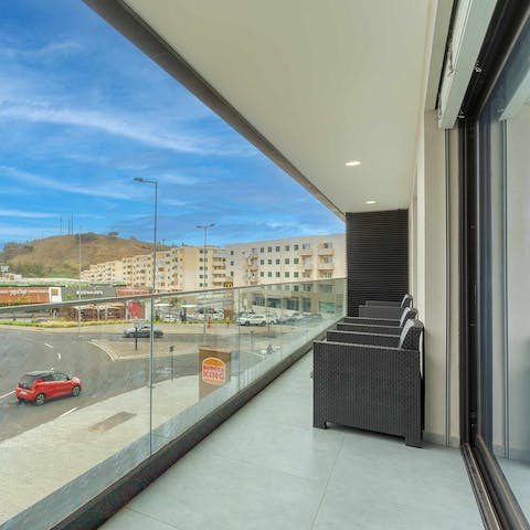 Sit out on the glass-fronted balcony and watch the world go by