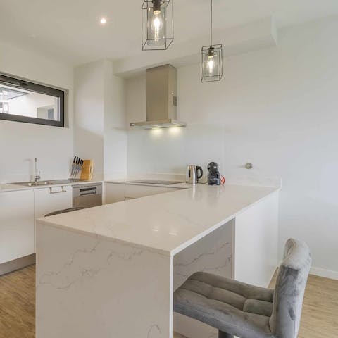 Savour your morning coffee while sat at the marble breakfast bar