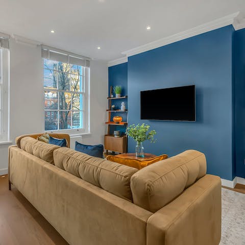 Relax in the living room with a glass of wine after a busy day of exploring