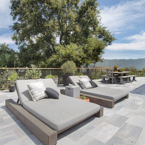 Laze on comfy day beds in the afternoons before diving into the pool