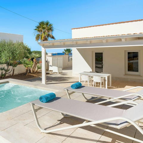 Relax on the sunbeds under the Sicilian sun