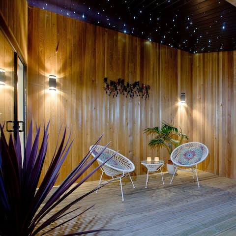 Sip alfresco drinks on the Acapulco chairs under the stars