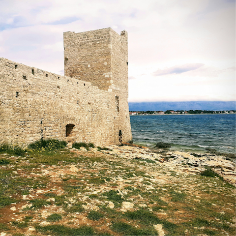 Explore the remains of Kastelina Castle, a twenty-minute stroll away