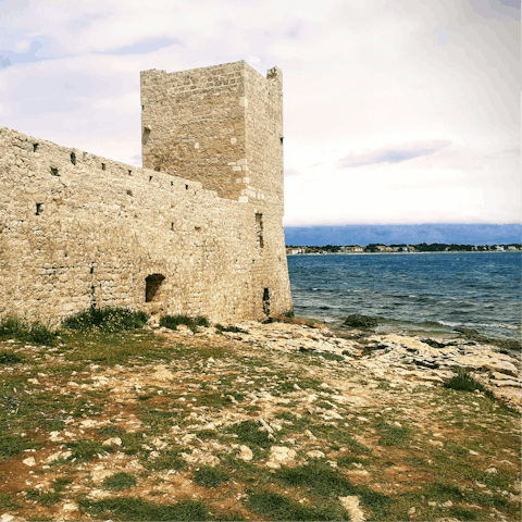 Explore the remains of Kastelina Castle, a twenty-minute stroll away