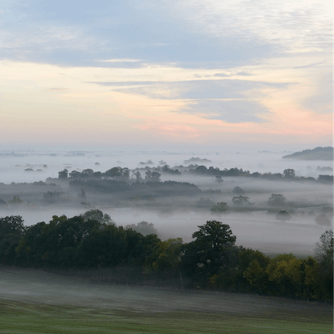 Follow hiking trails through the Cotswolds countryside