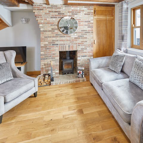 Cosy up here in front of this little log burner after strolling along the West Pier