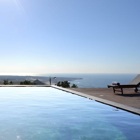 Swim gentle laps in the heated infinity swimming pool