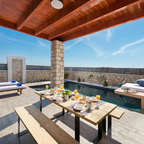 Set up for breakfast in the shade of the wooden pergola