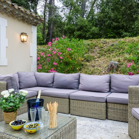 Share an apéritif in the outdoor lounge