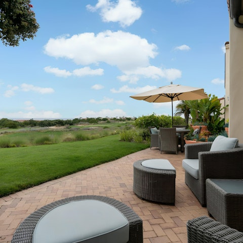 Take in the views over the golf course from this home's private terrace